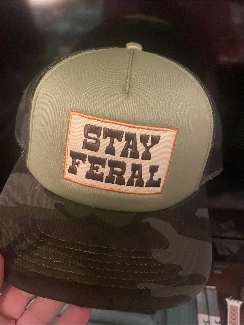 Stay Feral Trucker Hat - Olive Front with Camo Brim